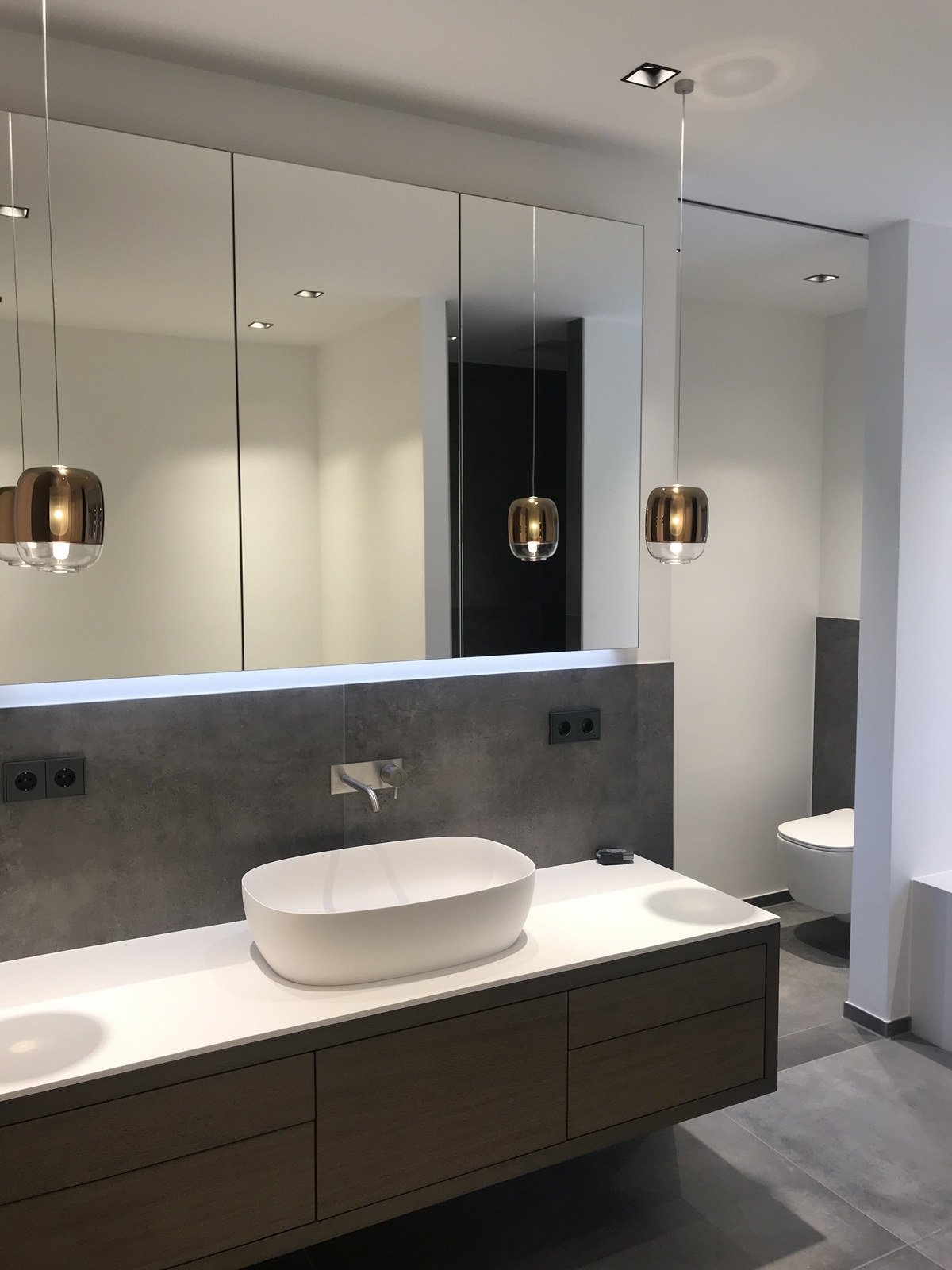 Premium matte-finish faucets paired with elegant ambient lighting for a private sanctuary.