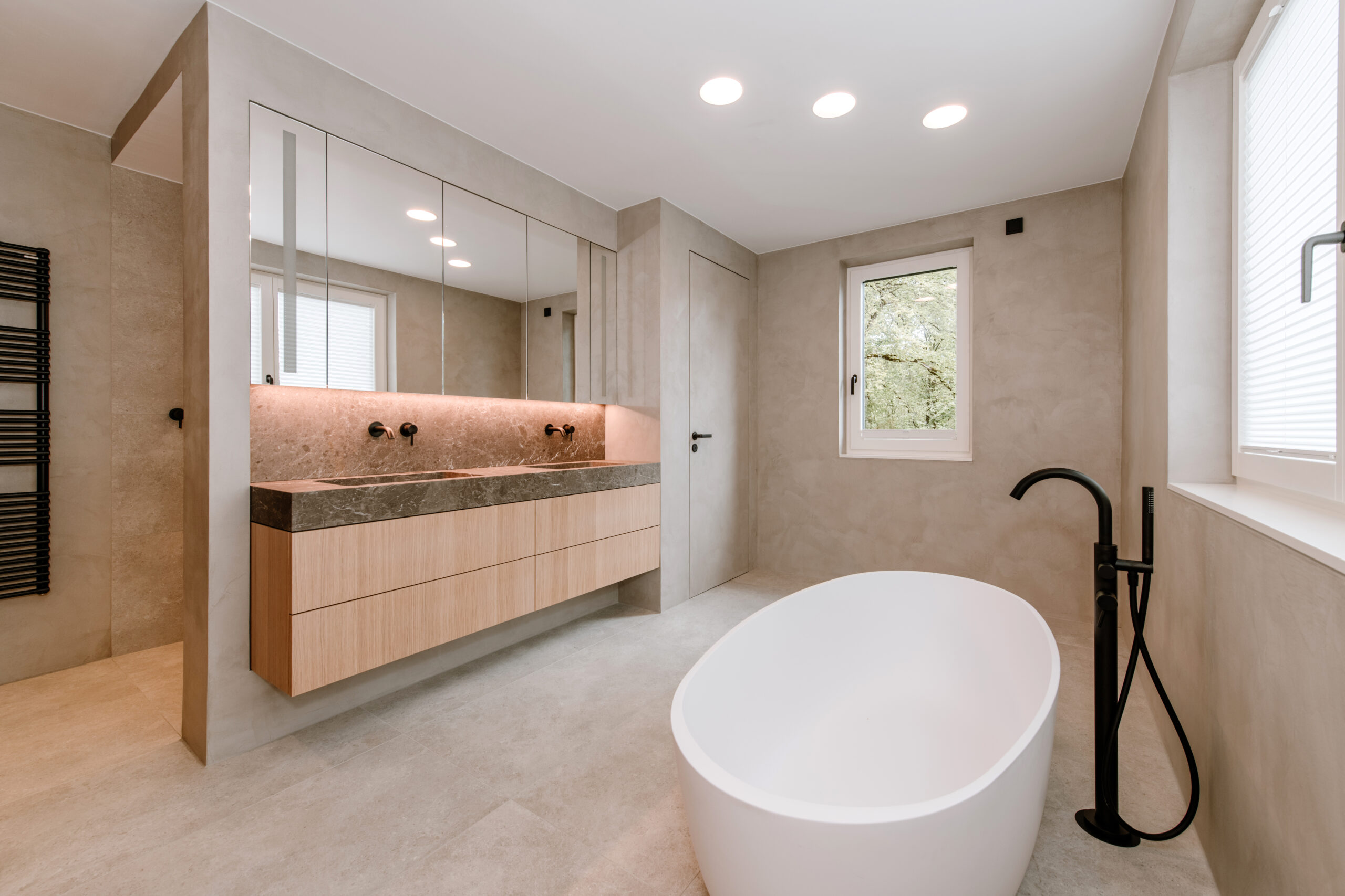 Custom-made bathroom cabinetry featuring master-class carpentry and integrated storage.
