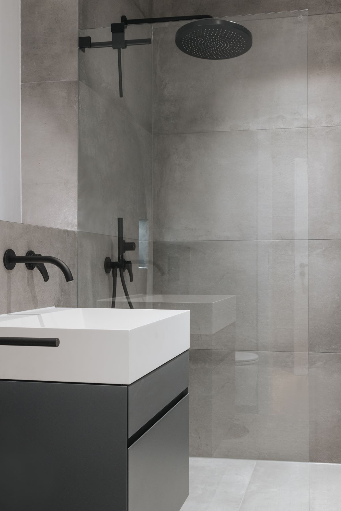 Luxury bathroom interior showcasing premium natural stone surfaces and elegant textures.