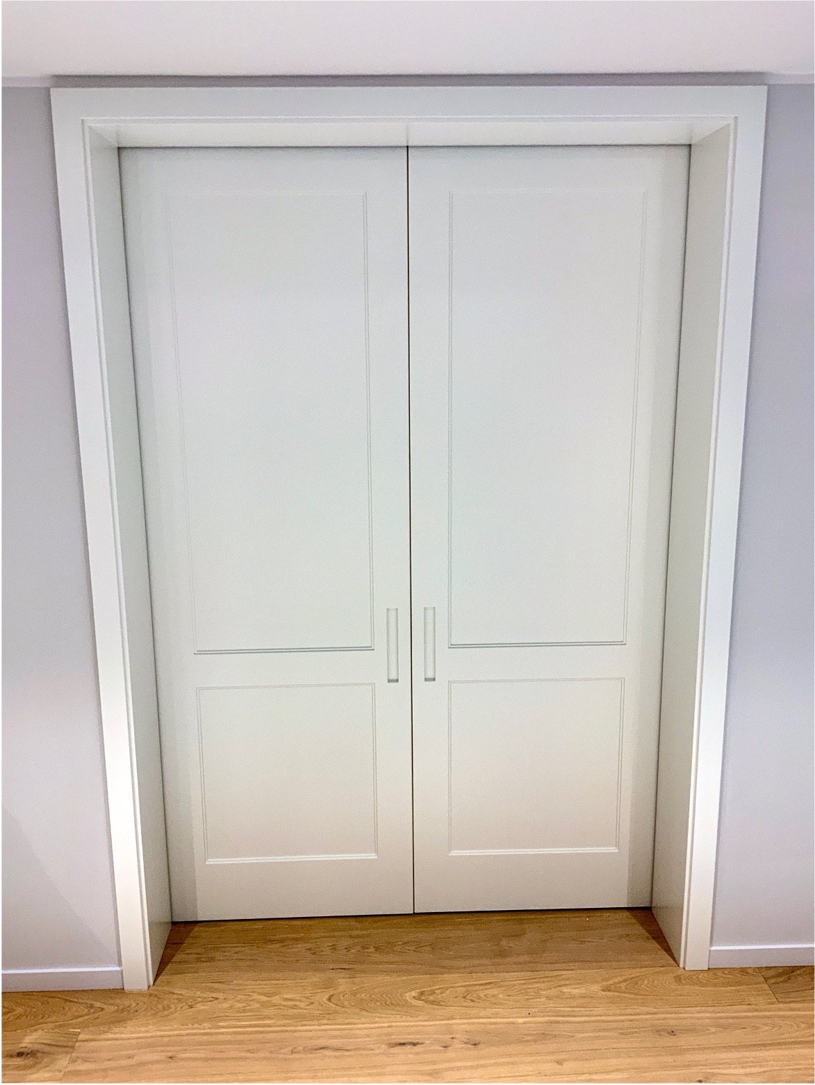 Grand double door entrance with bespoke timber finish and elegant handles