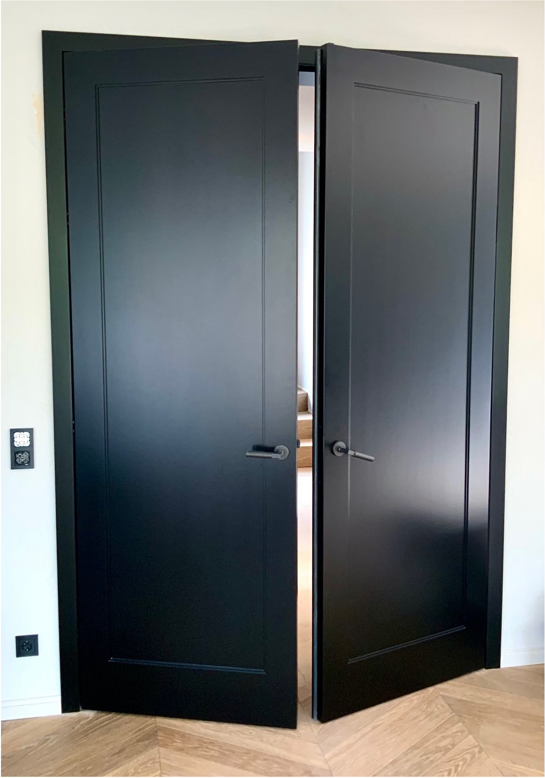 Classic-modern internal wing doors creating a prestigious room transition